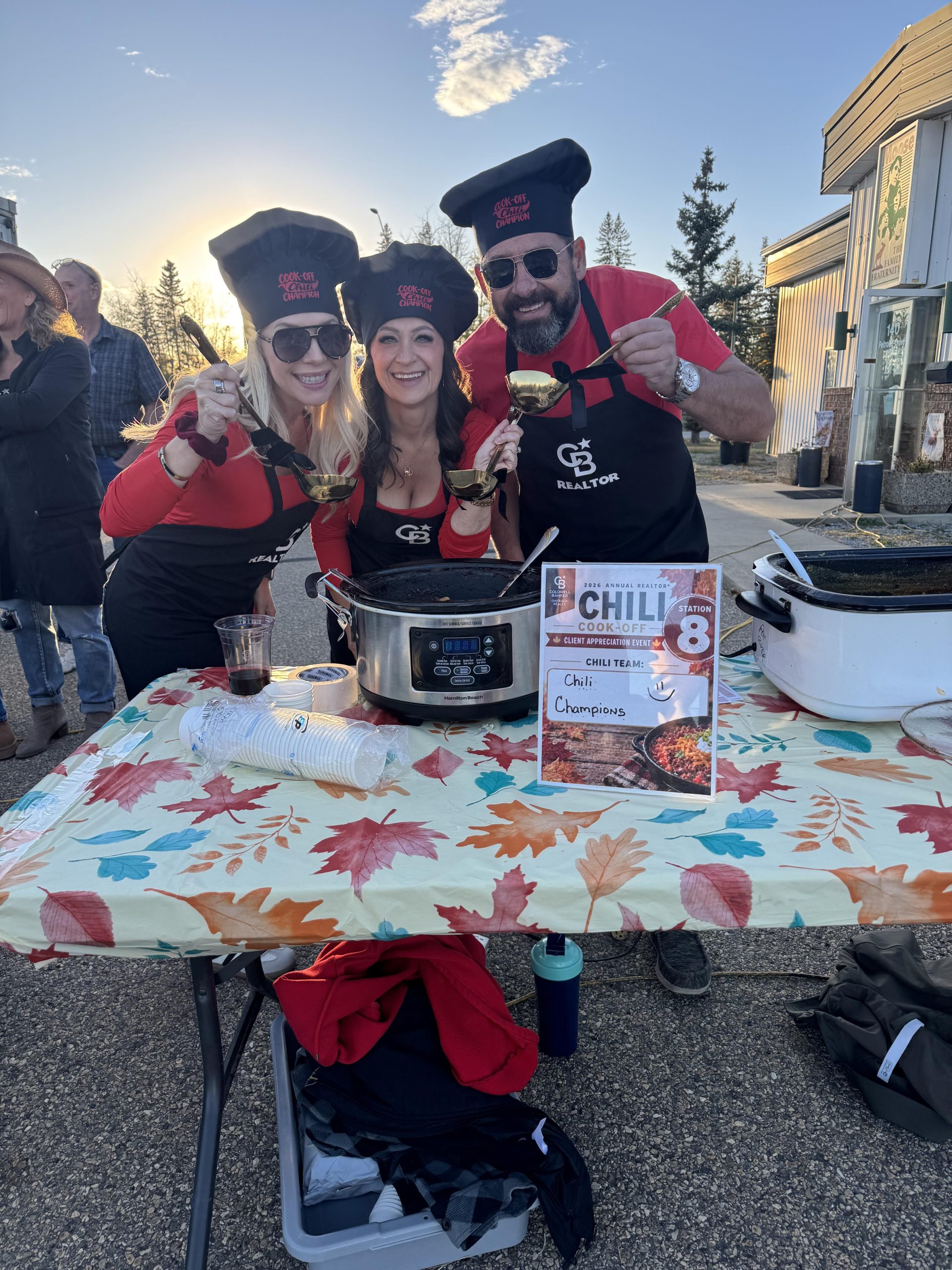 Carrie Meir and her team, The Chili Champions, in chef hats at the Coldwell Banker OnTrack Realty chilli cook-off in Red Deer