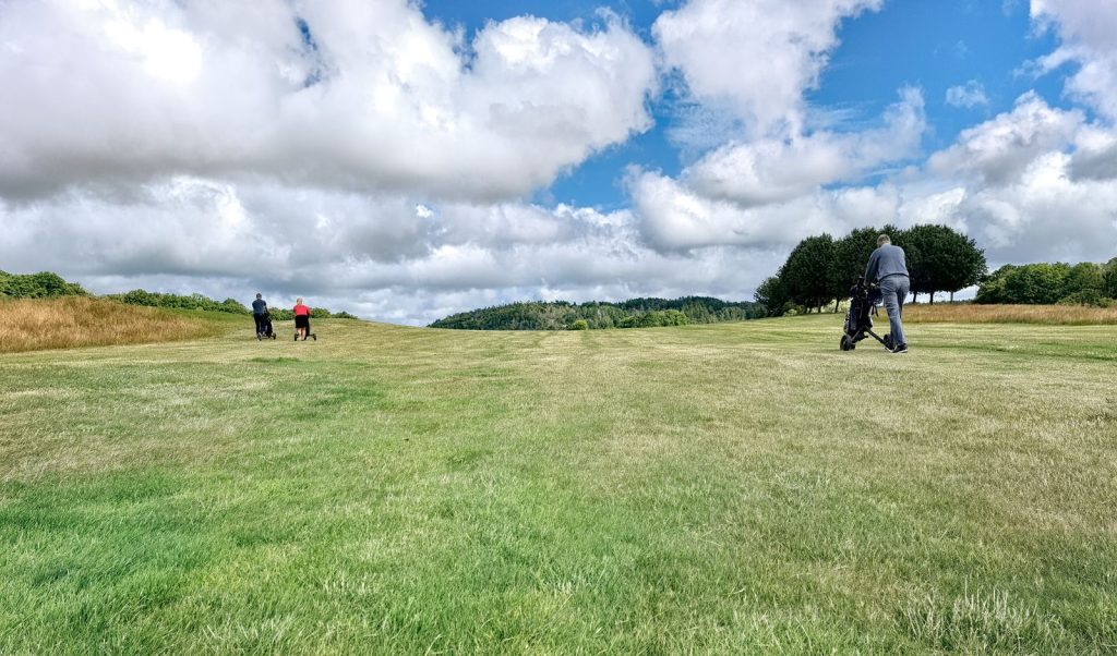 Golfers walking the fairway, golf in Lacombe Alberta